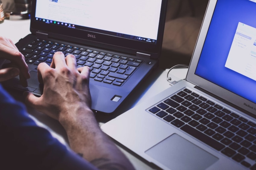 Man typing on a laptop