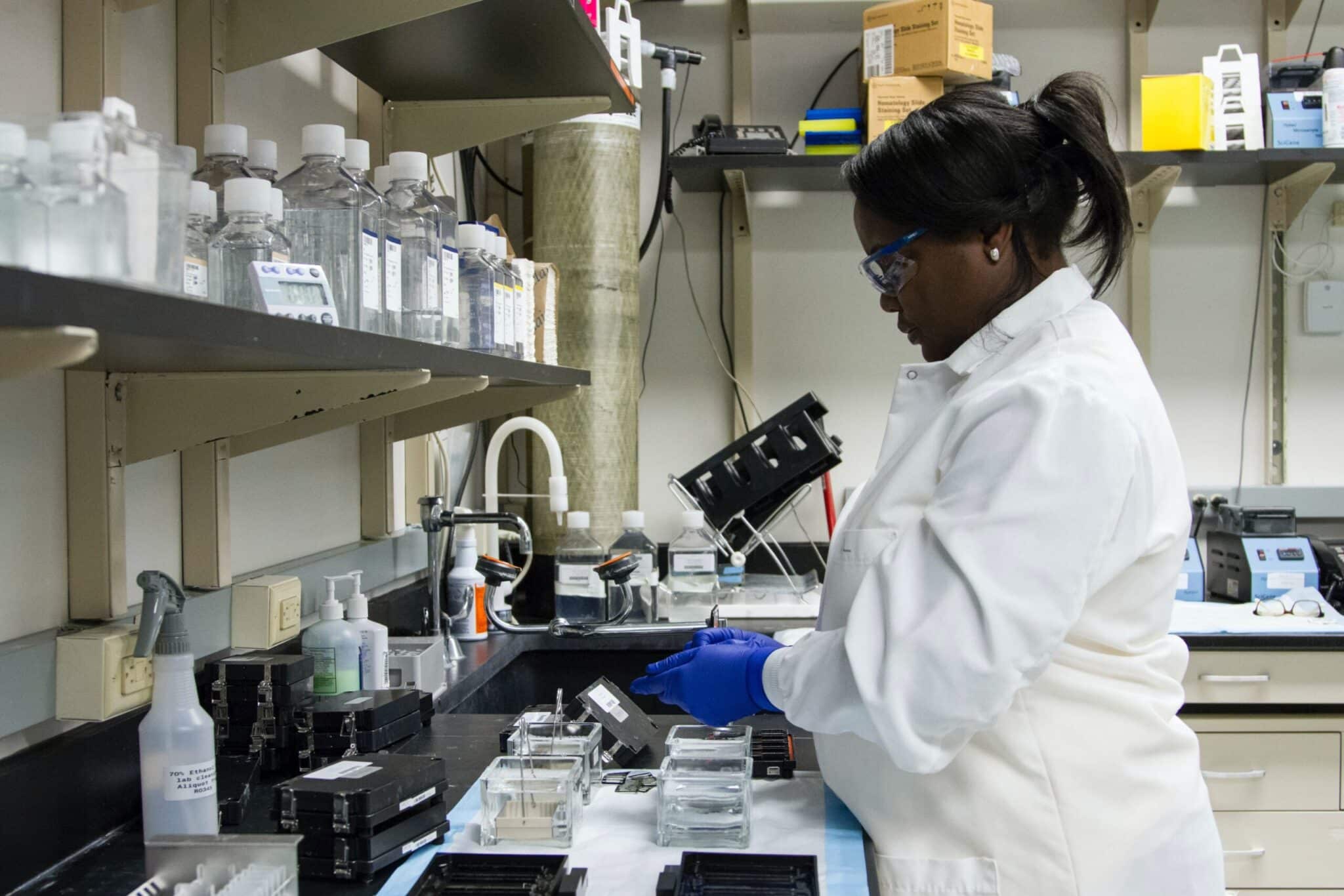 Female epidemiologist working in a lab setting