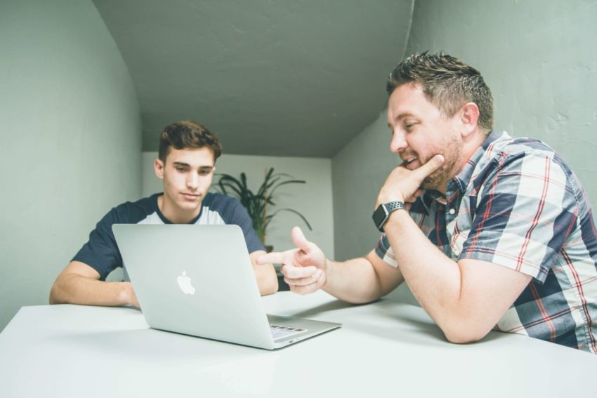 Older student mentoring a young student