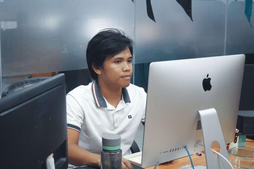 Man teaching on a desktop computer