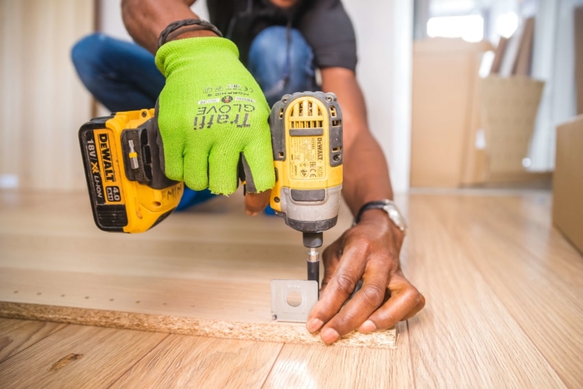 This carpenter enjoys the self-employed life and is hard at work building a shelf.