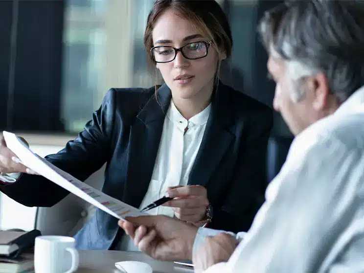 female business lawyer explaining a document to a client