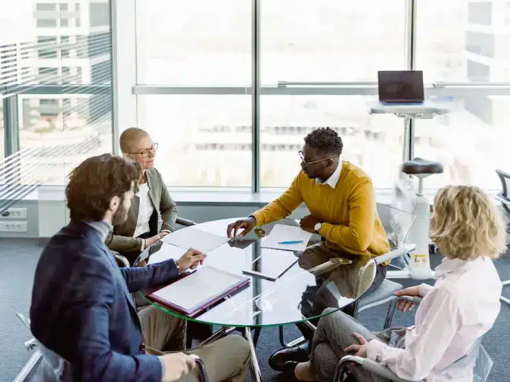 business lawyers confering around a round table