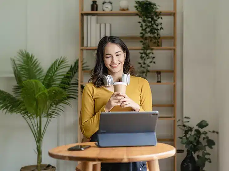 a female associate degree student listening to a lecture online