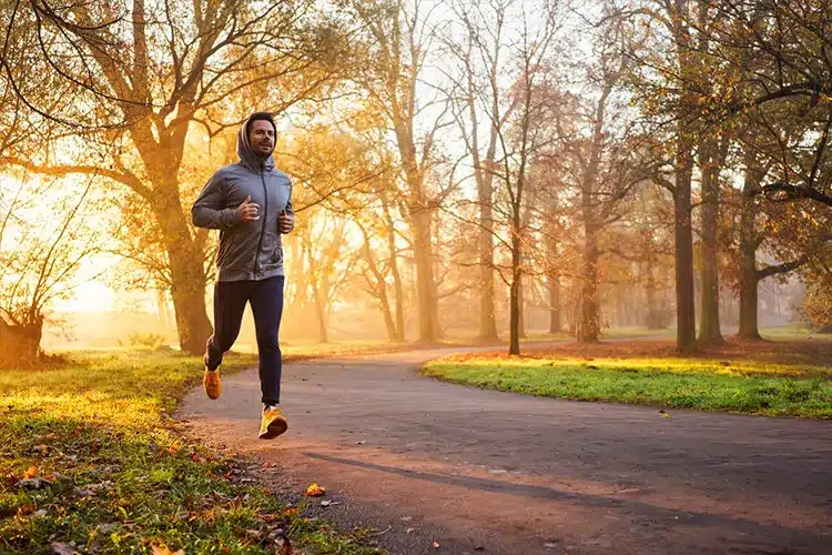 a male MBA student jogging to unwind