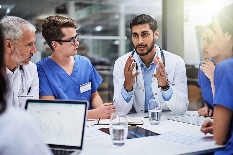 a male doctor discussing public policy with his peers